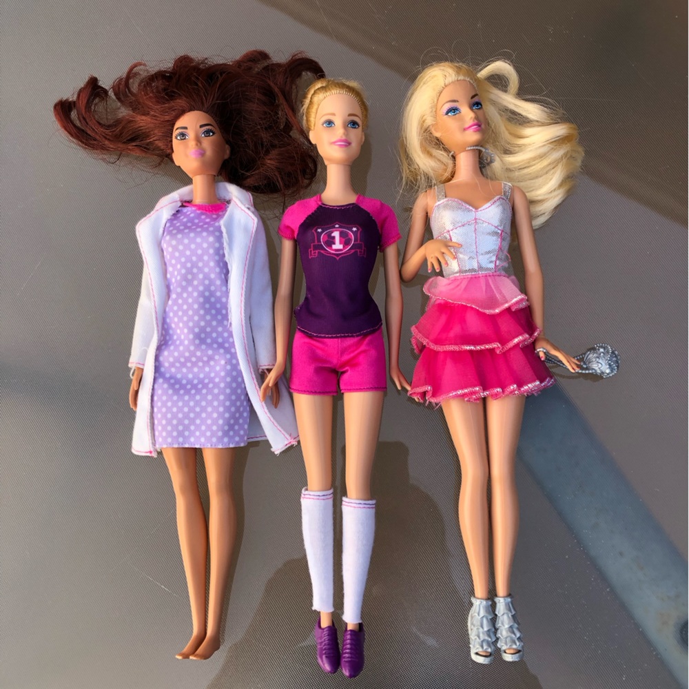 3 Barbies with clothing/shoes they are wearing